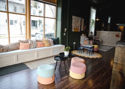 Modern chiropractic office with cozy seating and colorful decor.