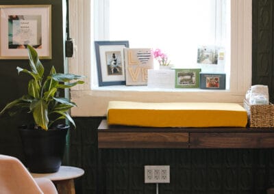 Cozy office window with plants and framed photos at Bright Futures Chiropractic.