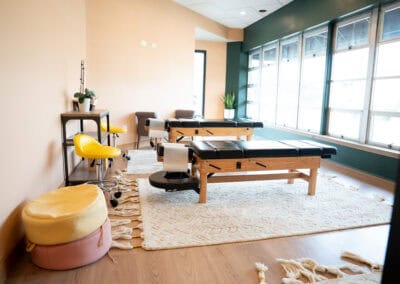 Bright Futures Chiropractic treatment room with massage tables and relaxing decor.
