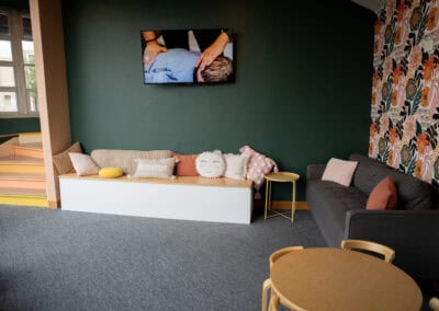 Modern chiropractic office interior with cozy seating and calming decor.